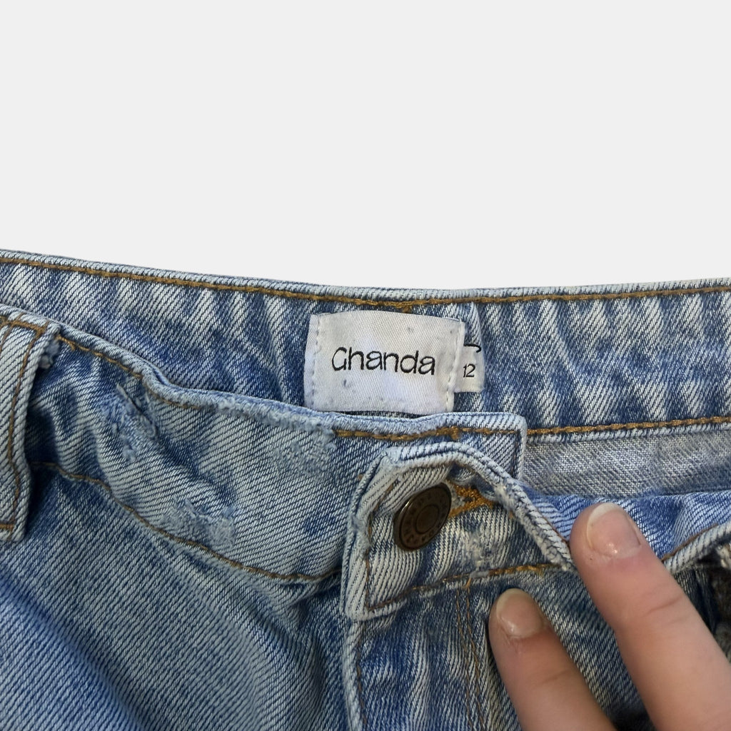 Ghanda High Waisted Light Wash Distressed Denim Shorts.